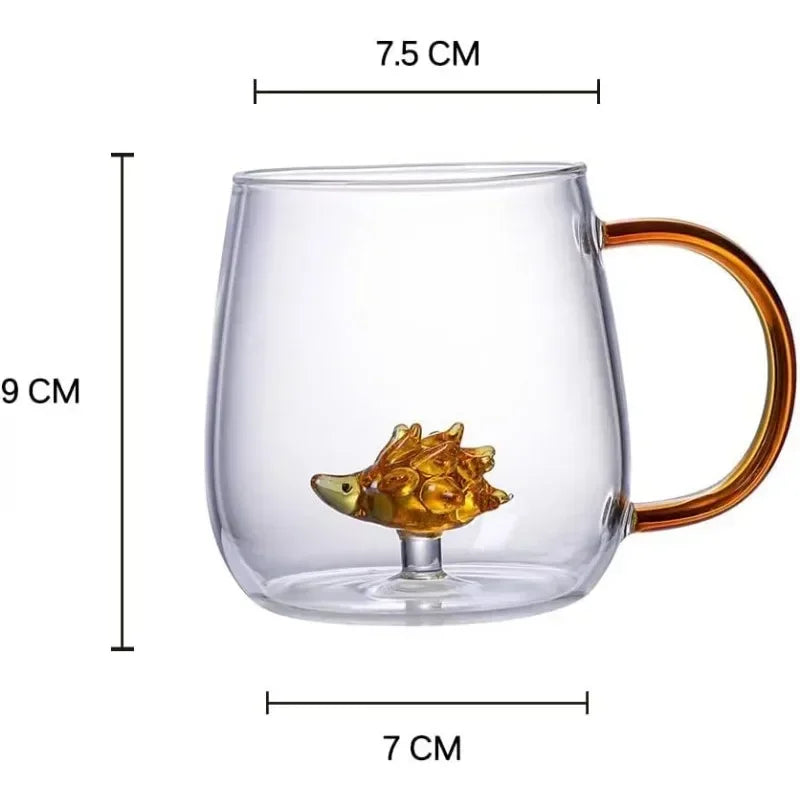 Clear glass mug with gold handle and hedgehog design, shown with measurements on a white background.