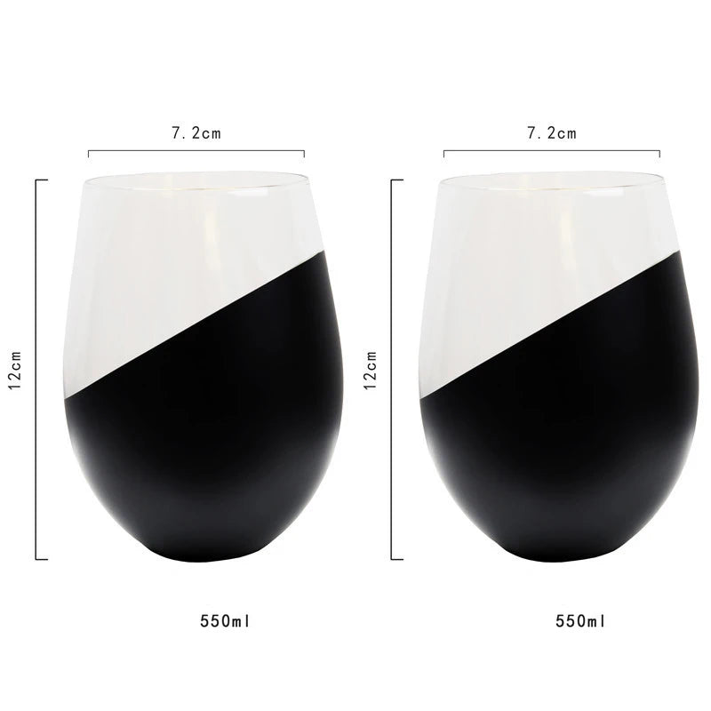 Two black and white wine glasses with measurements on a white background