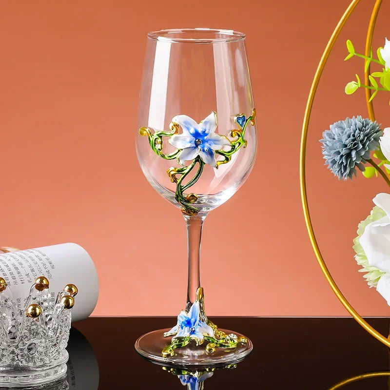Decorative wine glass with floral designs on a peach-colored background