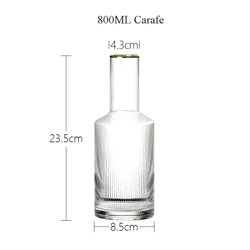 Clear glass carafe with dimensions on a white background