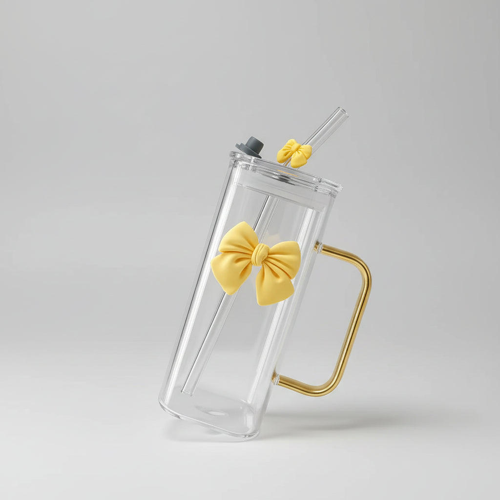 Clear phone case with yellow bow design held by a hand in an indoor setting.