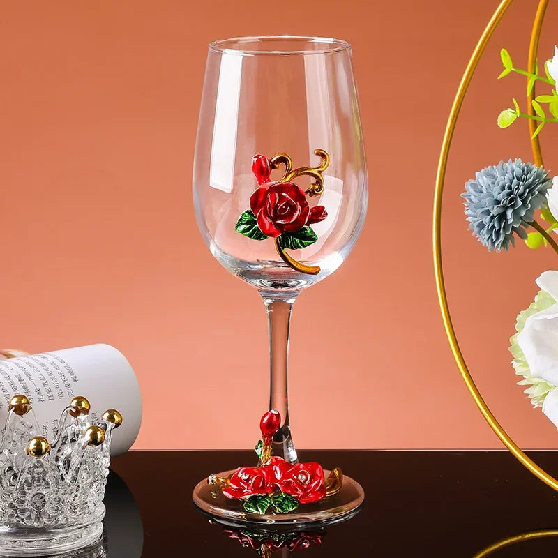 Wine glass with red rose design on a peach-colored background