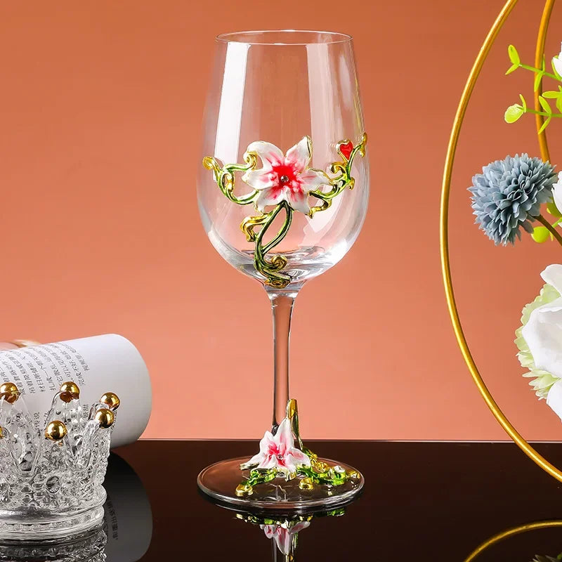Decorative wine glass with floral design on a peach-colored background