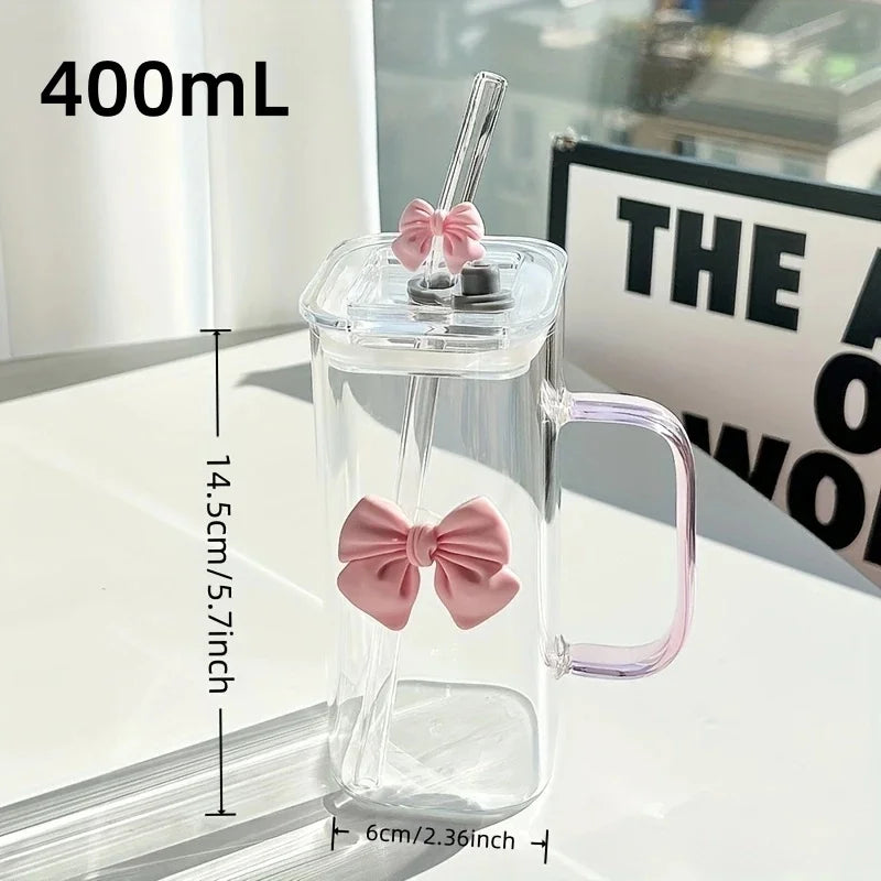 Clear mug with pink bow design, handle, and straw, 400mL capacity, measurements shown.
