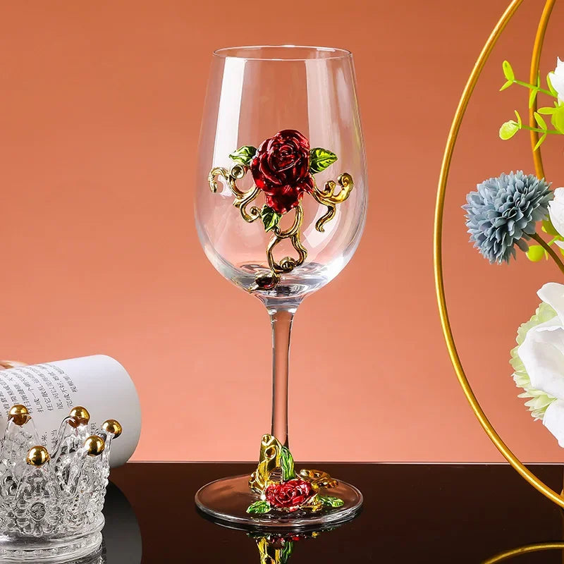 Decorative wine glass with floral design on a peach-colored background