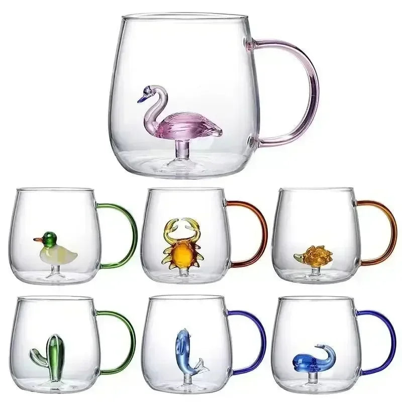 Set of glass mugs with animal figurines on a white background