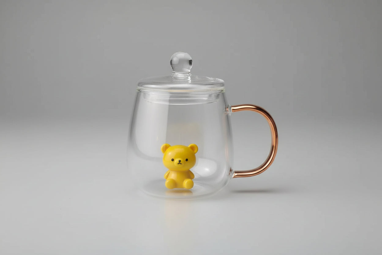 Clear glass mug with a handle and a small figurine of a dinosaur held by a hand against a tiled wall background.