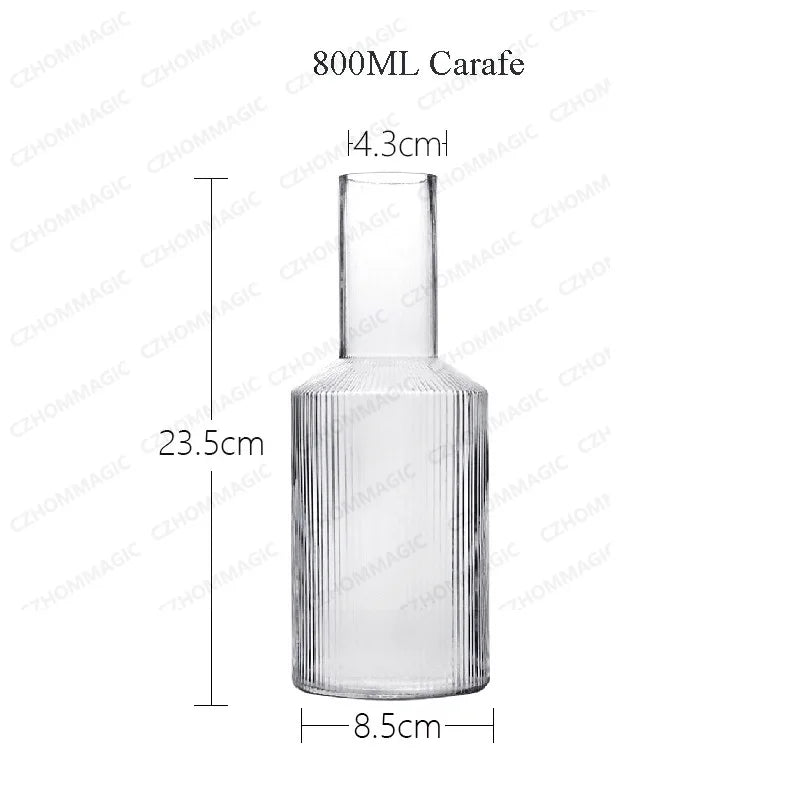 Clear glass carafe with dimensions on a white background