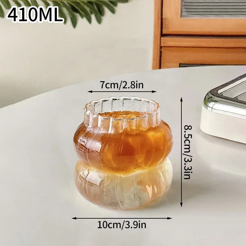 Glass container with honey, showing measurements on a light surface.