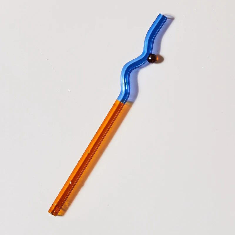 Two-toned straw with blue top and orange bottom on a white background