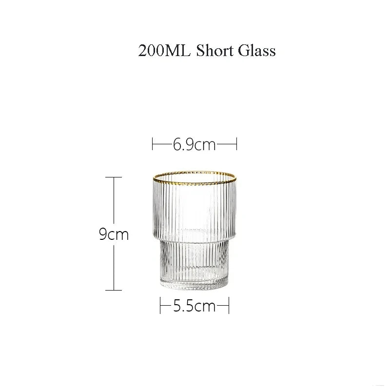 Clear glass with gold rim and measurements on a white background